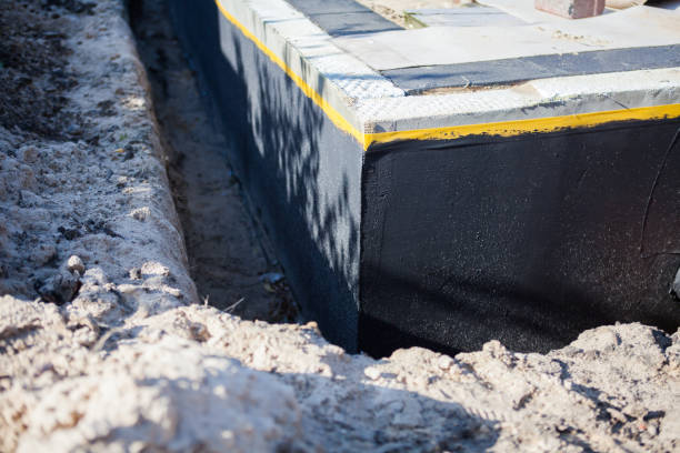 Professional Waterproofing technician working in Clayton, AL
